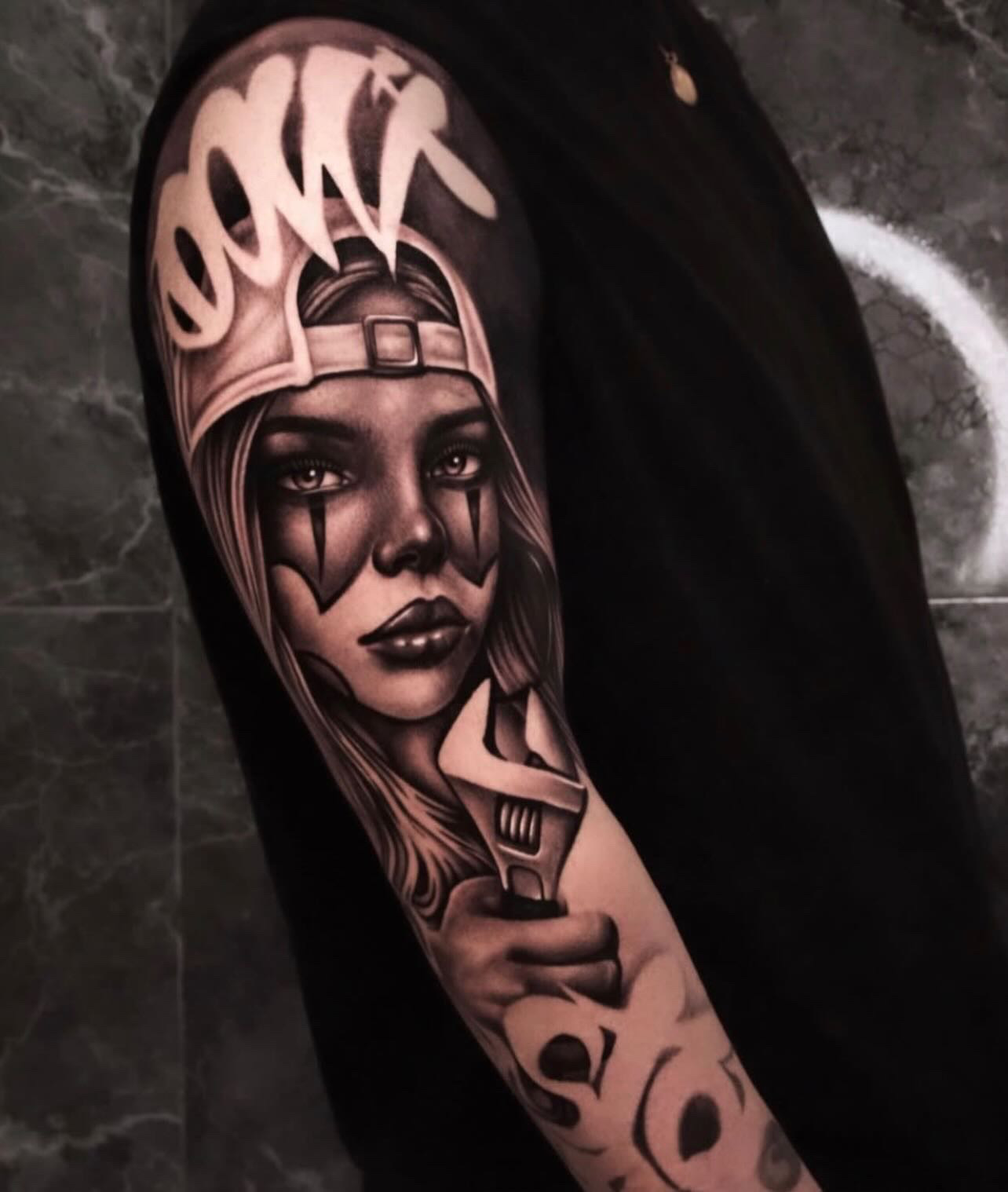 Chicana girl with wrench